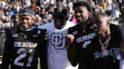 Colorado Buffaloes head coach Deion Sanders and quarterback Shedeur Sanders after the win against the Oklahoma State Cowboys