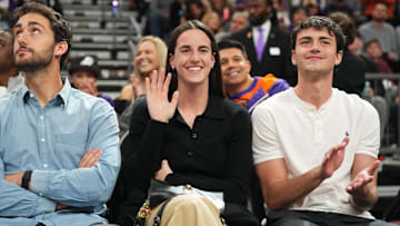 Nov 30, 2024; Phoenix, Arizona, USA; Indiana Fever player Caitlin Clark attends the game between the Phoenix Suns and the Golden State Warriors during the first half at Footprint Center. Mandatory Credit: Joe Camporeale-Imagn Images
