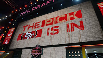 The San Francisco 49ers logo is projected on the video board during the NFL Draft