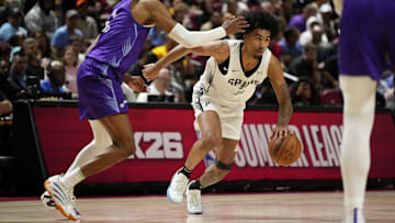 Jul 14, 2025; Las Vegas, NV, USA; San Antonio Spurs guard Dylan Harper dribbles the ball against Utah Jazz forward Cody Williams (5) during the second half of a NBA basketball game at the Thomas & Mack Center. Mandatory Credit: Lucas Peltier-Imagn Images