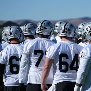 Jul 24, 2025; Henderson, NV, USA; Las Vegas Raiders players huddle during training camp at the Intermountain Healthcare Performance Center. Mandatory Credit: Kirby Lee-Imagn Images
