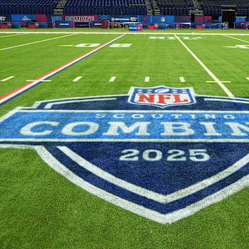 The 2025 NFL Scouting Combine logo on the field at Lucas Oil Stadium.