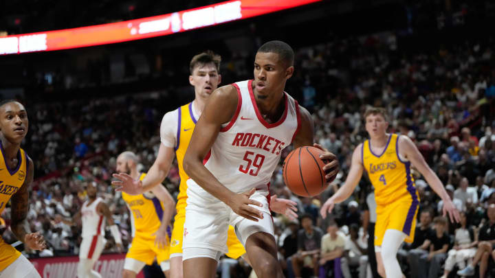 Jul 12, 2024; Las Vegas, NV, USA; Houston Rockets center Orlando Robinson (59) controls the ball against the Los Angeles Lakers during the first half at Thomas & Mack Center. Mandatory Credit: Lucas Peltier-USA TODAY Sports