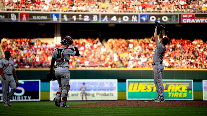 Boston Red Sox pitcher Kutter Crawford (50) gets a visit at the mound in the second inning of the MLB baseball game between the Cincinnati Reds and the Boston Red Sox at Great American Ball Park in Cincinnati on June 21, 2024.