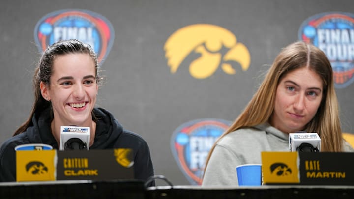 Iowa Hawkeyes guard Caitlin Clark and guard Kate Martin (20) take questions before the Final Four round of the NCAA Women's Basketball Tournament, Thursday, April 4, 2024 in Cleveland.