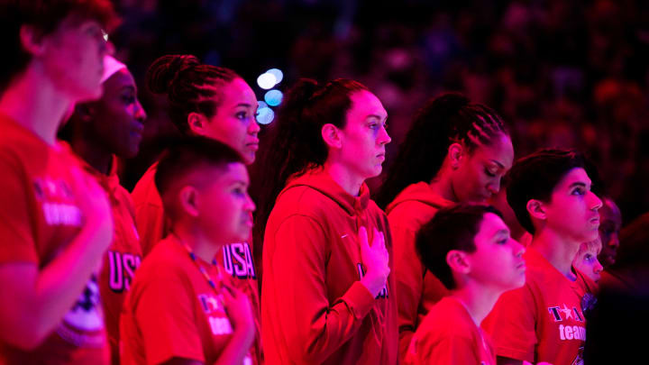 Team USA forward Breanna Stewart (center) and her teammates listen to the national anthem during the WNBA All-Star Game at Footprint Center in Phoenix on July 20, 2024.