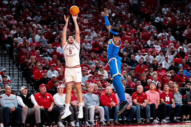 Nebraska Cornhuskers forward Berke Buyuktuncel (9) shoots a three-point basket against UCLA Bruins guard Dominick Harris (8) 