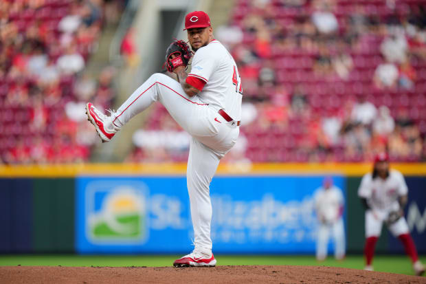 Frankie Montas winds up and throws a pitch. 