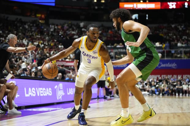 Los Angeles Lakers guard Bronny James (9) dribbles the ball against Boston Celtics forward Anton Watson (28).