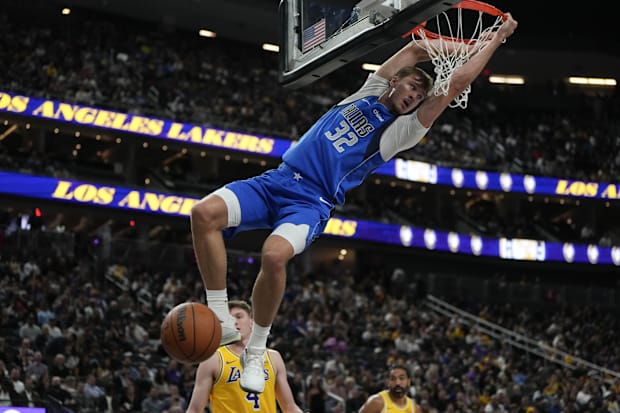 Mavericks  forward Cooper Flagg (32) dunks the ball against the Los Angeles Lakers 
