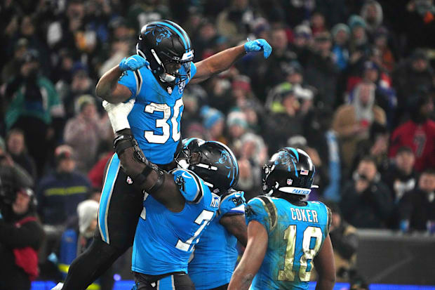 Carolina Panthers running back Chuba Hubbard (30) celebrates a touchdown during the 2024 NFL Munich Game at Allianz Arena. 