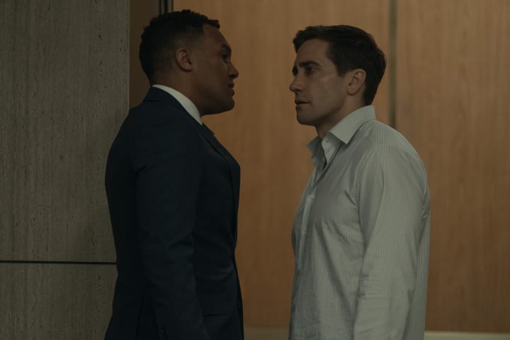 O-T Fagbenle as Nico Dell Guardia stares intensely at Jake Gyllenhaal as Rusty Sabich to his right