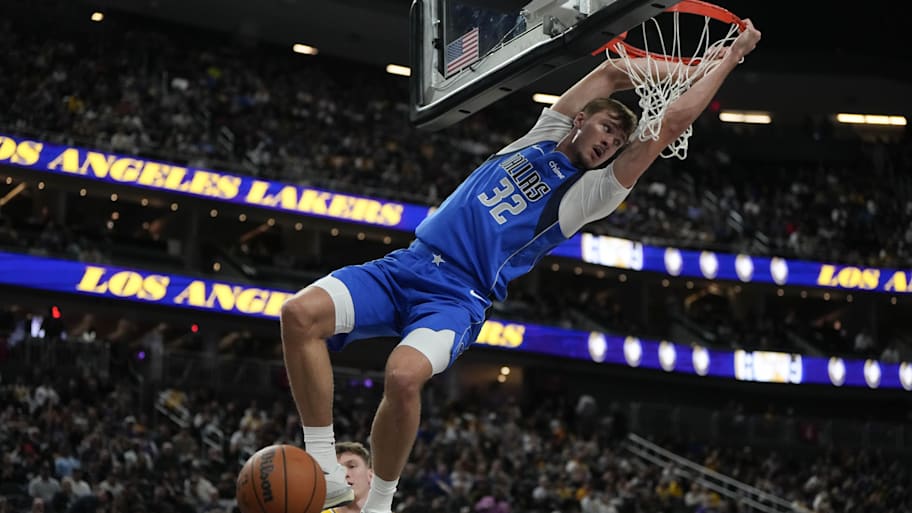 Mavericks forward Cooper Flagg (32) dunks the ball against the Los Angeles Lakers