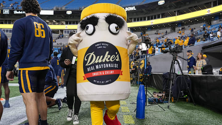 Dec 27, 2023; Charlotte, NC, USA; Official Mayo Bowl mascot during pregame warm ups between the North Carolina Tar Heels and the West Virginia Mountaineers  at Bank of America Stadium. Mandatory Credit: Jim Dedmon-Imagn Images