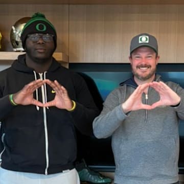 Five-star offensive tackle Immanuel Iheanacho with Oregon Ducks coach Dan Lanning