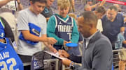 Nico Harrison signed autographs for Mavericks fans before Wednesday’s game against the Pelicans.