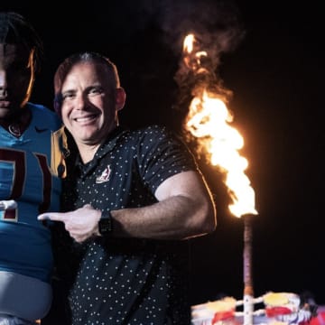Peyton Joseph poses with Florida State coach Mike Norvell