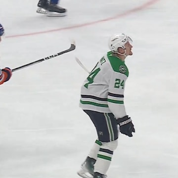 Edmonton Oilers defenseman Evan Bouchard slashes Dallas Stars forward Roope Hintz in Game 4.