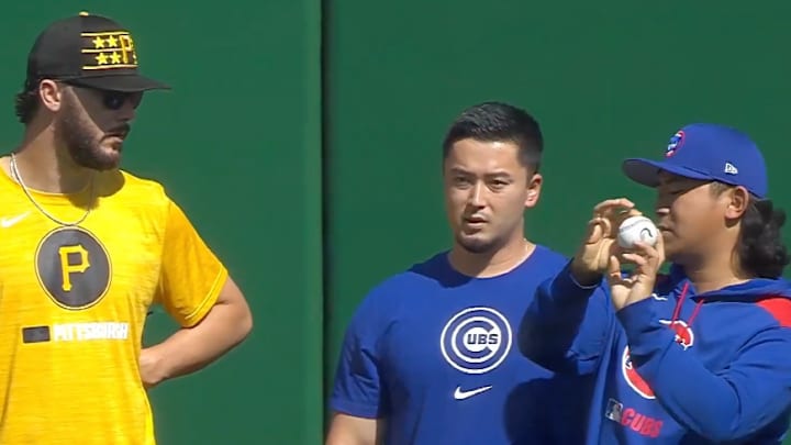 Skenes (left) receiving a pointer from Imanaga (right). Skenes (left) receiving a pointer from Imanaga (right).