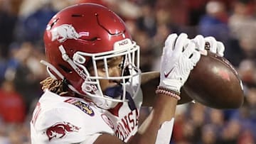 Arkansas Razorbacks tight end Ty Washington (8) scores a touchdown in the first quarter against the Kansas Jayhawks