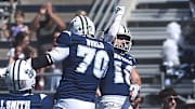 Nevada’s Marcus Bellon (18) and Isaiah World celebrate a touchdown while taking on Eastern Washington during their football game at Mackay Stadium in Reno on Sept. 21, 2024.