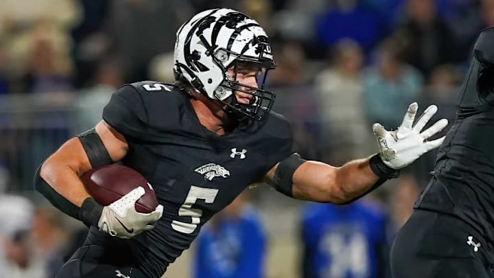 Grandview's Bleu Hubbard carries the ball in a semifinal game against Peaster. 