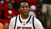 Dec 6, 2025; Raleigh, North Carolina, USA;  NC State Wolfpack guard Quadir Copeland (11) dribbles the ball during the first half of the game against UNC Asheville Bulldogs at Lenovo Center. Mandatory Credit: Jaylynn Nash-Imagn Images