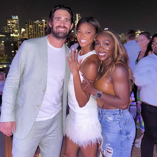 Gaby Rocks Olympic champ Gabby Thomas rocks jean shorts, heels fit out with friends