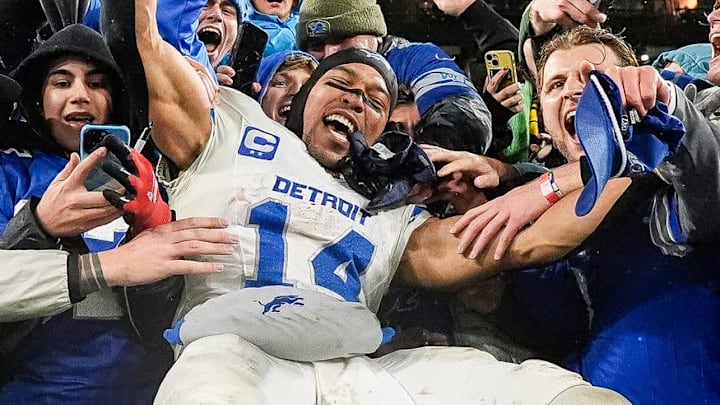 Detroit Lions wide receiver Amon-Ra St. Brown leaps into Lions fans as they celebrate the 24-14 win over the Green Bay Packers at Lambeau Field in Green Bay, Wis. on Sunday, Nov. 3, 2024. Detroit Lions wide receiver Amon-Ra St. Brown leaps into Lions fans as they celebrate the 24-14 win over the Green Bay Packers at Lambeau Field in Green Bay, Wis. on Sunday, Nov. 3, 2024.