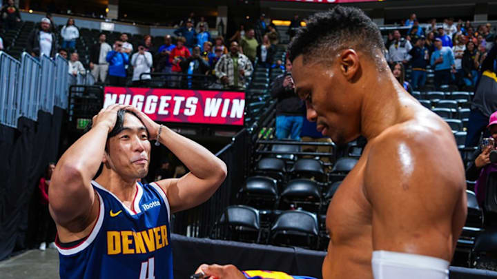 Westbrook with a fan after the Nuggets game. Westbrook with a fan after the Nuggets game.