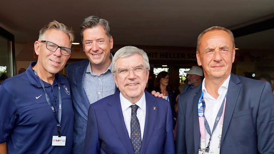 Mike Knopp, David Holt, then IOC president Thomas Bach and International Canoe Federation president Thomas Konietzko in Paris