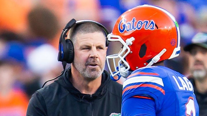 Florida Gators head coach Billy Napier talks with Florida Gators quarterback DJ Lagway (2) during the first half at Ben Hill Griffin Stadium in Gainesville, FL on Saturday, November 16, 2024. [Doug Engle/Gainesville Sun]