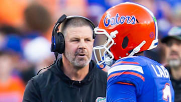 Florida Gators head coach Billy Napier talks with Florida Gators quarterback DJ Lagway (2) during the first half at Ben Hill Griffin Stadium in Gainesville, FL on Saturday, November 16, 2024. [Doug Engle/Gainesville Sun]