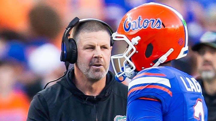 Florida Gators head coach Billy Napier talks with Florida Gators quarterback DJ Lagway (2) during the first half at Ben Hill Griffin Stadium in Gainesville, FL on Saturday, November 16, 2024. [Doug Engle/Gainesville Sun]