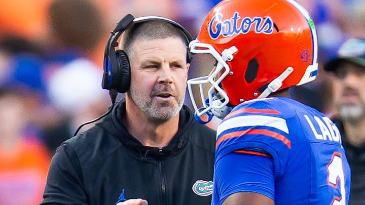 Florida Gators head coach Billy Napier talks with Florida Gators quarterback DJ Lagway (2) during the first half at Ben Hill Griffin Stadium in Gainesville, FL on Saturday, November 16, 2024. [Doug Engle/Gainesville Sun]