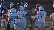 A Brookhaven Academy assistant football coach gets into a scuffle with Lamar School star quarterback Sullivan Reed during the second quarter of the Mississippi Association of Independent Schools (MAIS) Class 4A-D3 State Championship game at Mississippi College in Clinton. Reed was ejected, and Brookhaven was penalized for unsportsmanlike conduct.