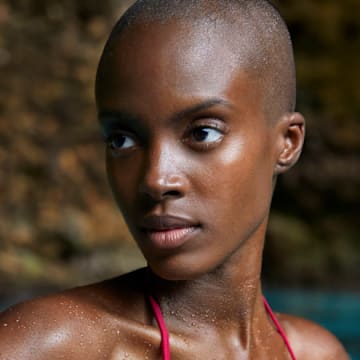 Madisin Rian was photographed by James Macari in the Dominican Republic. Swimsuit by HAUS OF PINKLEMONAID.