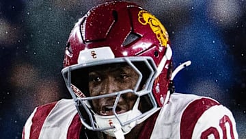Oct 18, 2025; South Bend, Indiana, USA; Southern California Trojans running back King Miller (30) runs the ball while Notre Dame Fighting Irish safety Tae Johnson (9) defends in the second half at Notre Dame Stadium. Mandatory Credit: Trevor Ruszkowski-Imagn Images