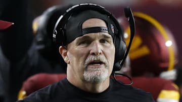 Aug 18, 2025; Landover, Maryland, USA; Washington Commanders head coach Dan Quinn looks on from the sidelines against the Cincinnati Bengals during the first quarter at Northwest Stadium. Mandatory Credit: Geoff Burke-Imagn Images