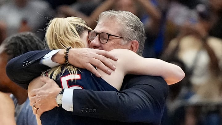 Geno Auriemma embraces Paige Bueckers in the final minutes of the NCAA championship.