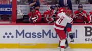 Carolina Hurricanes captain Jordan Staal levels Tom Wilson into the Washington Capitals bench during Game 2