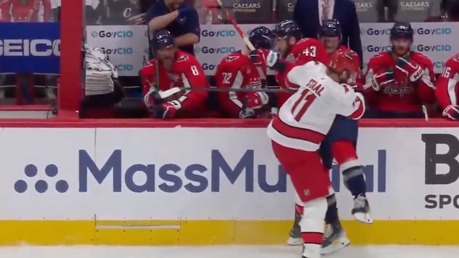 Carolina Hurricanes captain Jordan Staal levels Tom Wilson into the Washington Capitals bench during Game 2 | Screenshot via B/R Open Ice on X