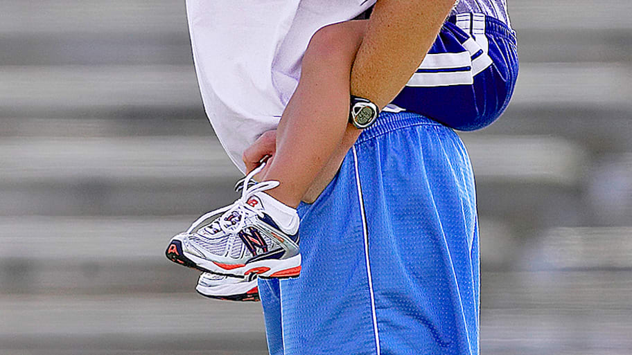 A young Arch Manning on the back of his dad, Cooper, in 2008.
