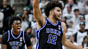 Duke's Cameron Boozer, center, celebrates after teammate Caleb Foster's 3-pointer against Michigan State during the second half on Saturday, Dec. 6, 2025, at the Breslin Center in East Lansing.