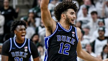 Duke's Cameron Boozer, center, celebrates after teammate Caleb Foster's 3-pointer against Michigan State during the second half on Saturday, Dec. 6, 2025, at the Breslin Center in East Lansing.