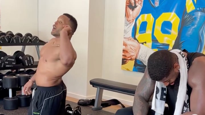 Aaron Donald works out while Jared Verse tries to catch his breath.