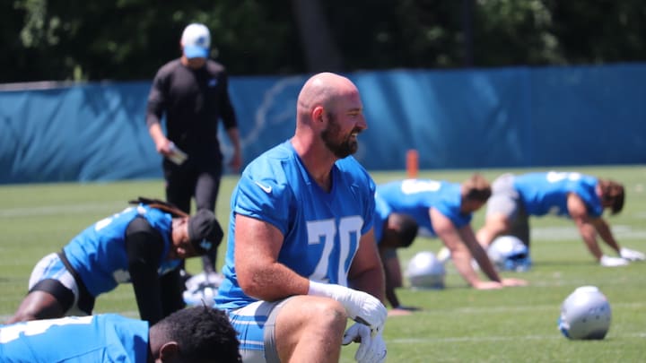 Detroit Lions offensive tackle Dan Skipper stretches prior to the team's mandatory minicamp practice on Thursday, June 6.