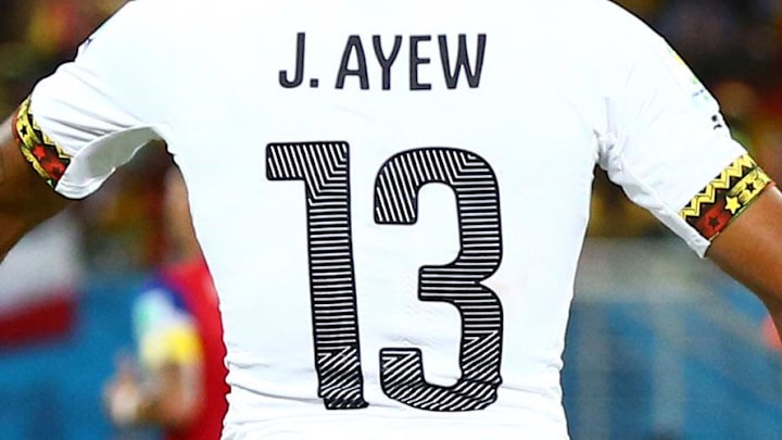 Jun 16, 2014; Natal, BRAZIL; FIFA referee Jonas Eriksson (right) talks with Ghana forward Jordan Ayew (13) against USA during the 2014 World Cup at Estadio das Dunas. USA defeated Ghana 2-1. Mandatory Credit: Mark J. Rebilas-Imagn Images