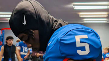 Reggie Hubbard III with his Cleveland High School jersey on in the weight room