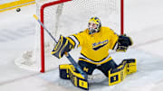 Michigan goaltender Jack Ivankovic watches the puck sail wide as the Wolverines enjoyed win No. 100 against Ohio State on Nov. 22, 2025.